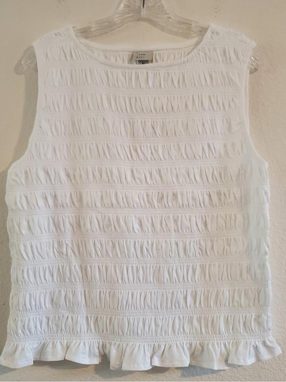 Women's White Sleeveless Ruffled Hem Top